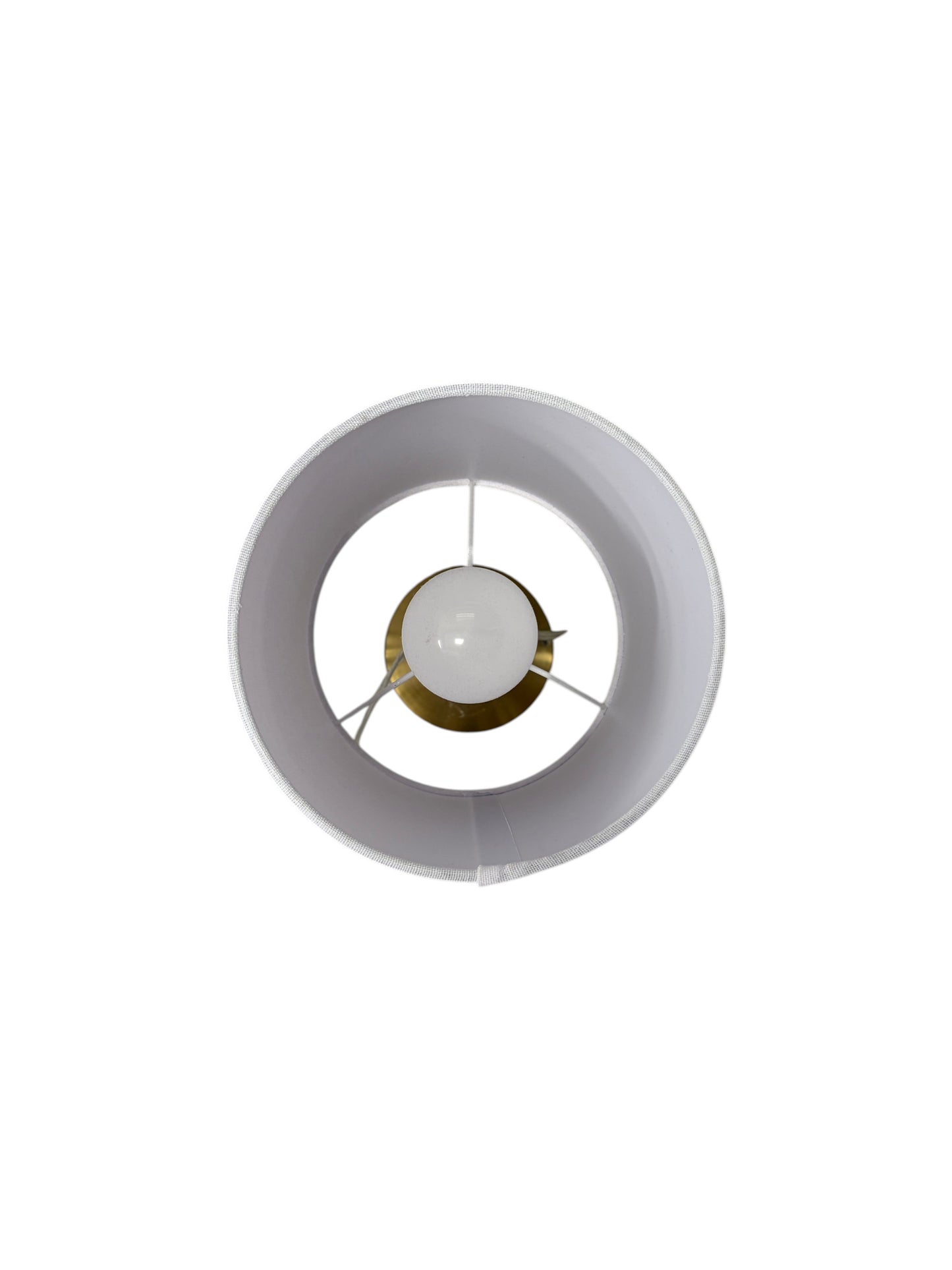 Gold lamp with a white shade and cord.