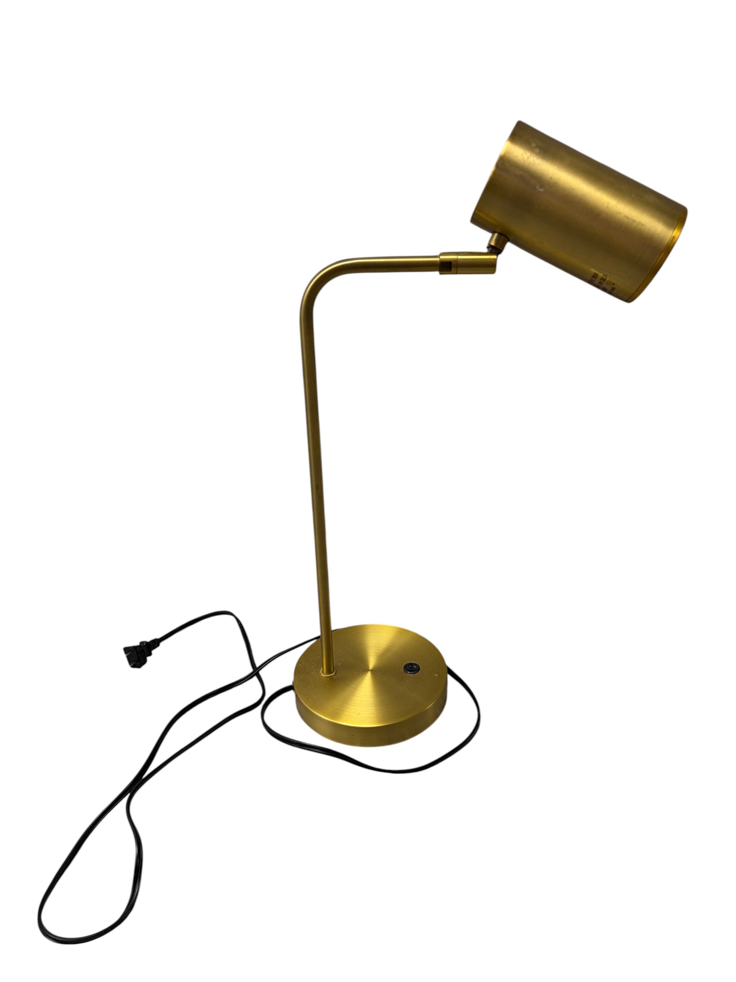Gold desk lamp with black cord.