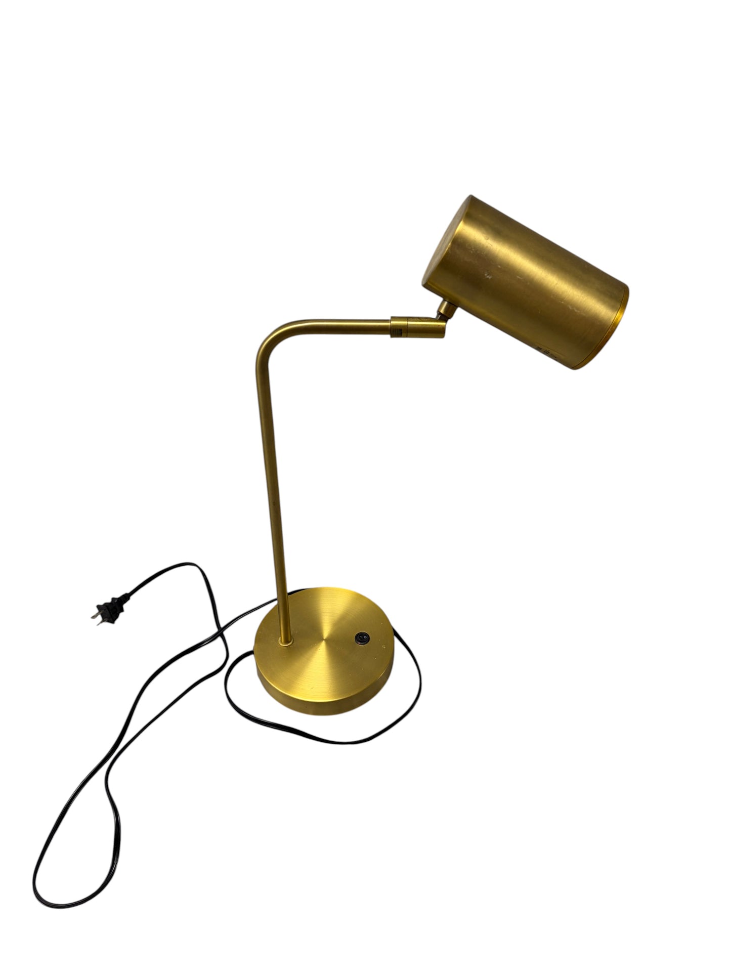 Gold desk lamp with black cord.