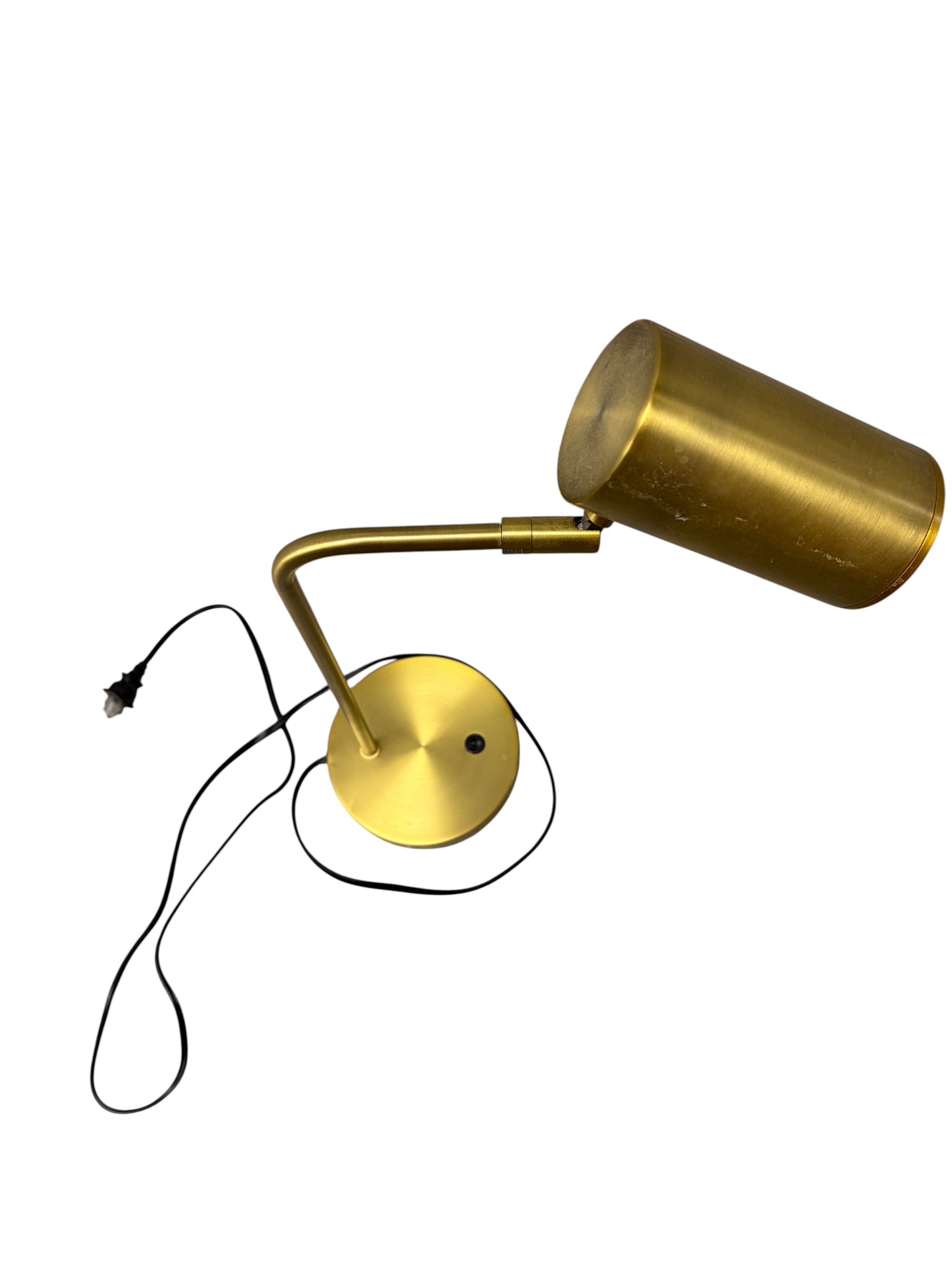 Gold desk lamp with black cord.