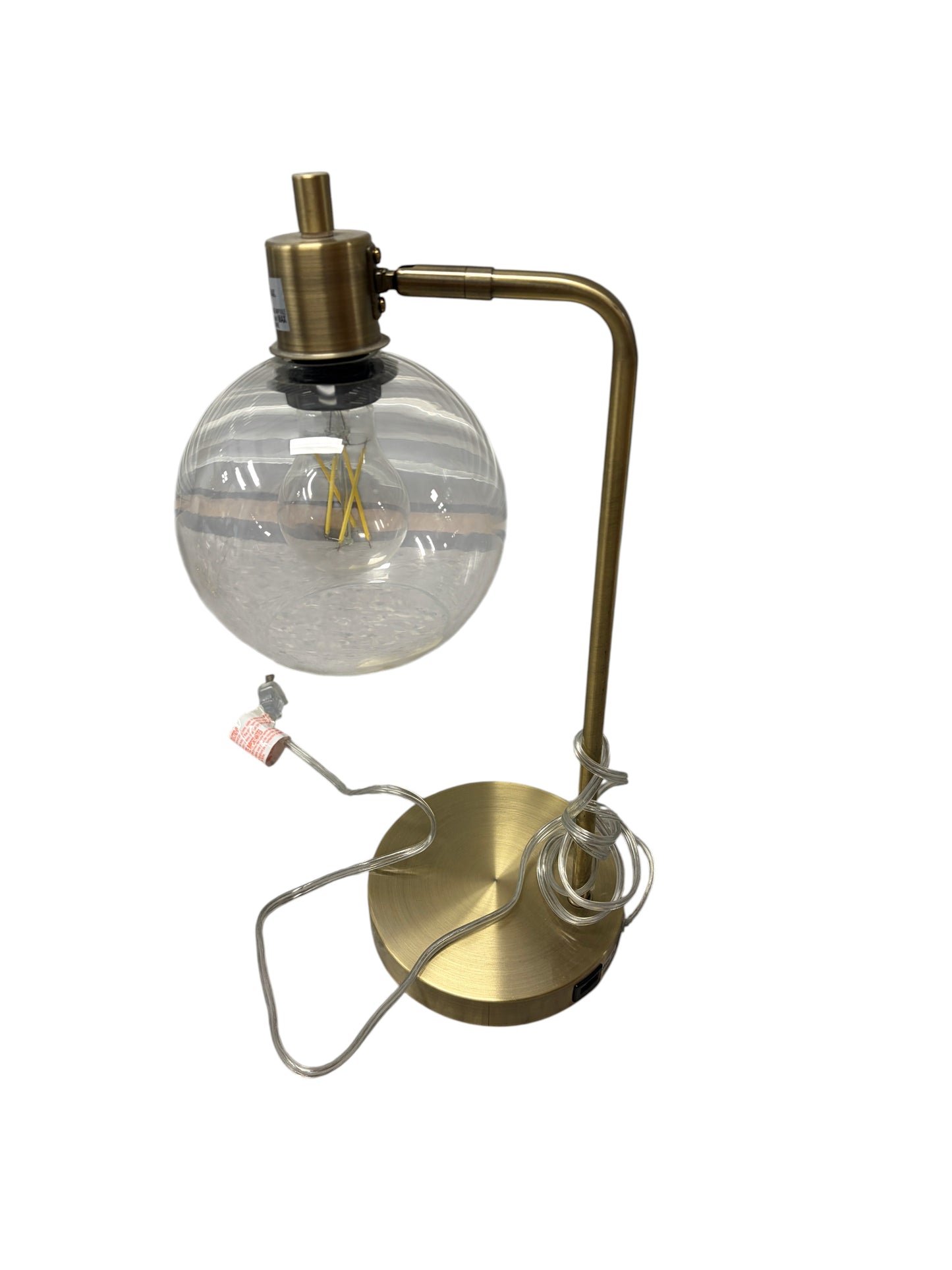 Gold desk lamp with clear glass shade and USB charging port.