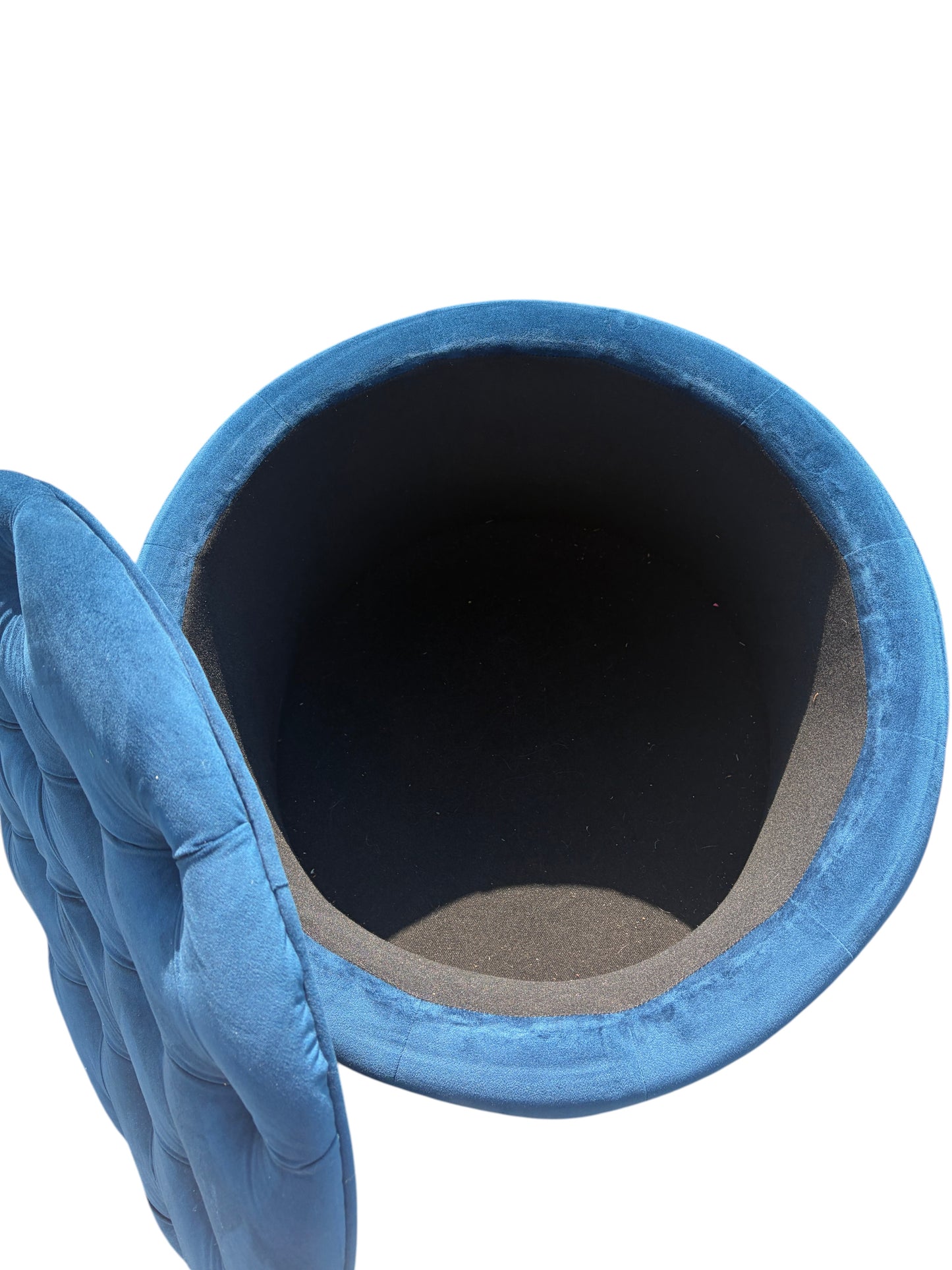 Blue round ottoman with storage inside.