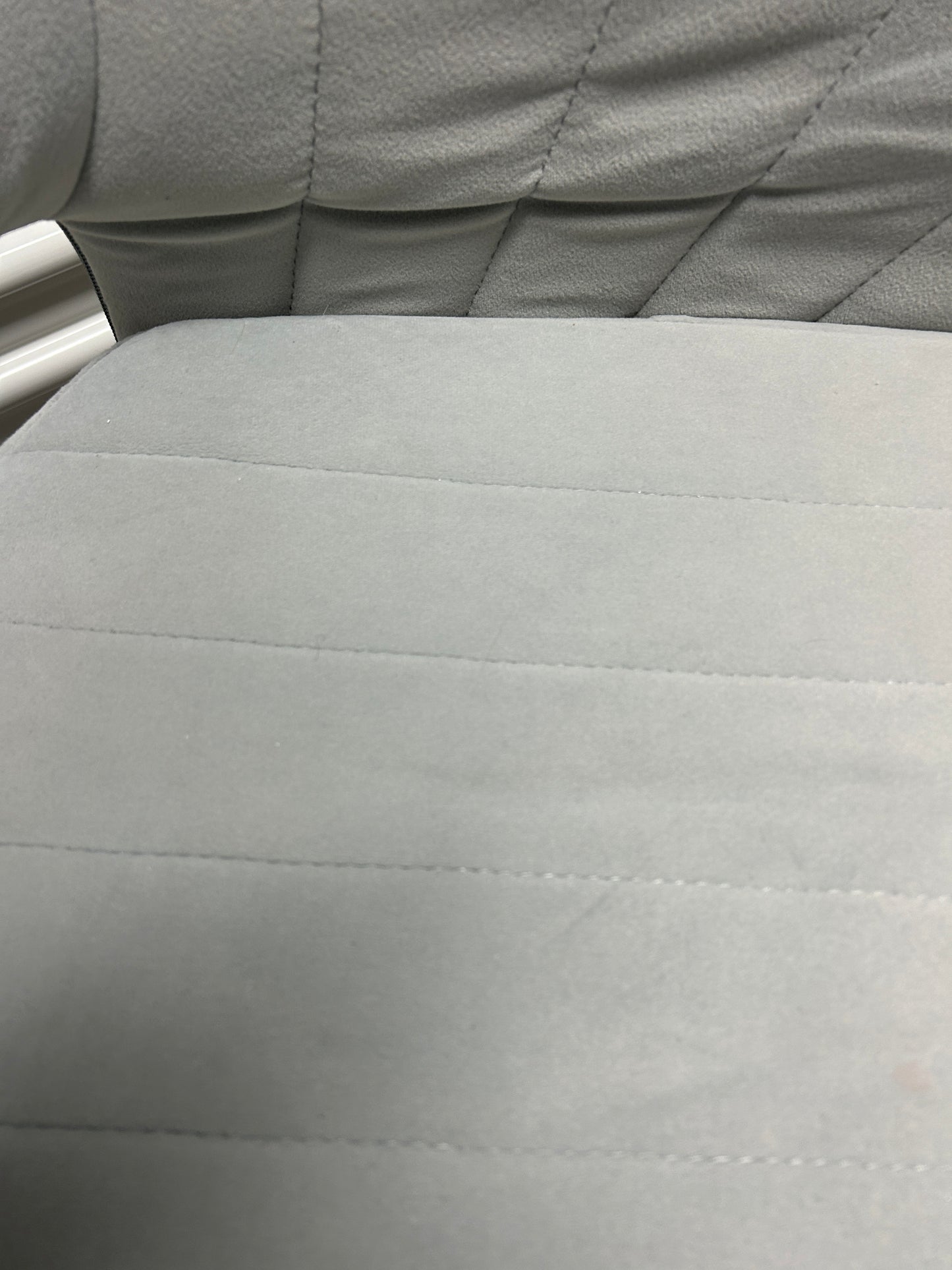 Light gray desk/office chair with a gold base.
