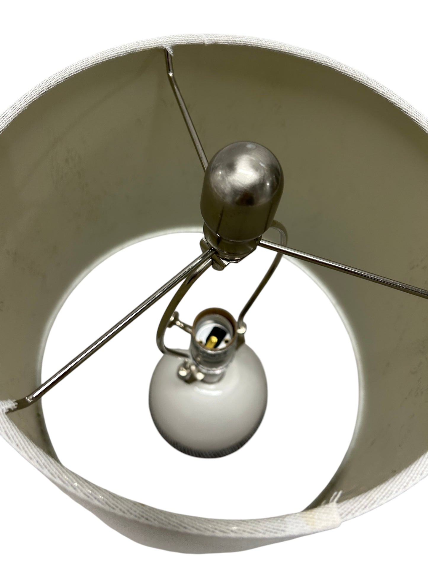 Gray and white table lamp with a textured ceramic base.