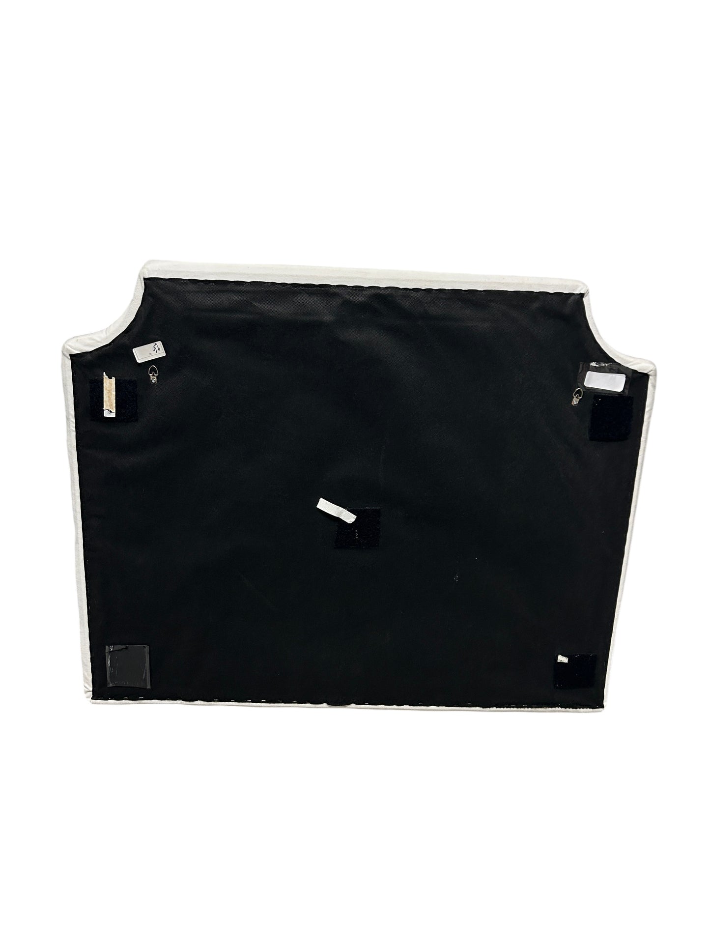 Cream velvet twin headboard with curved notched corners.