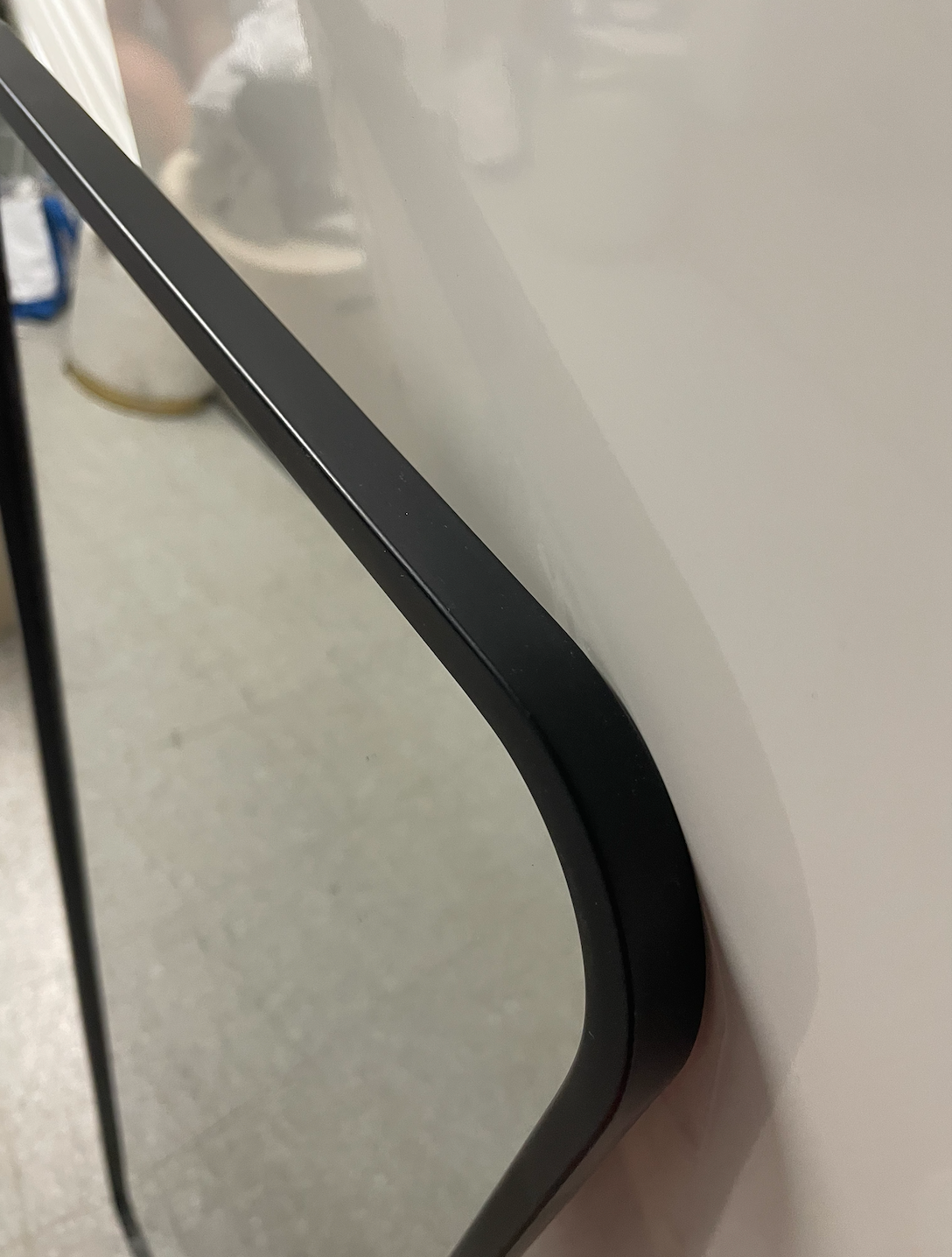 Target full-length standing floor mirror with a black frame.