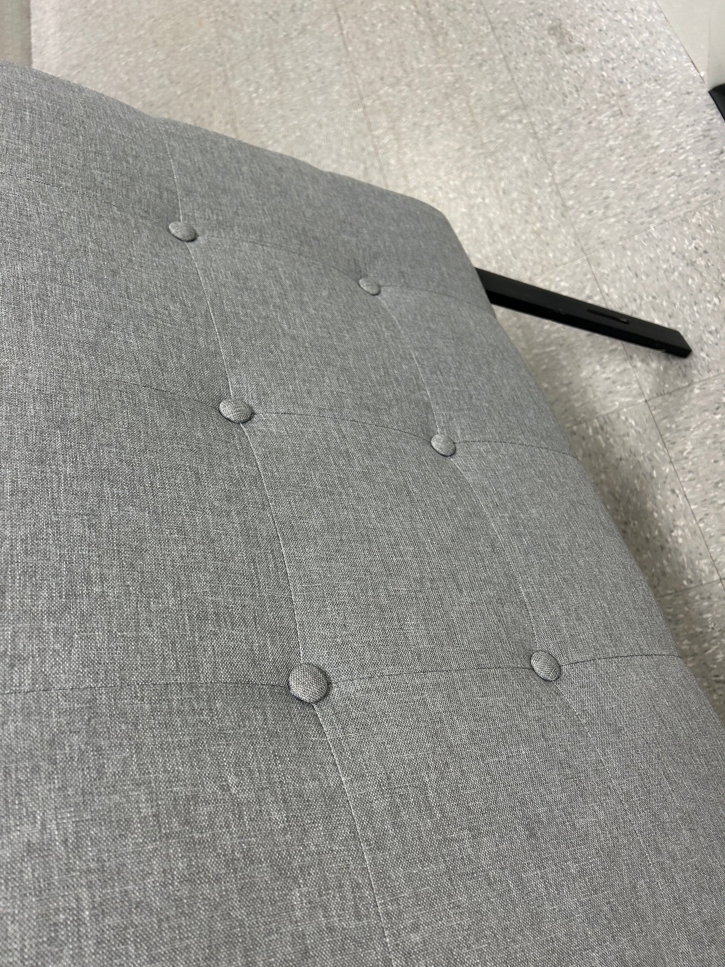 Gray twin headboard black legs.