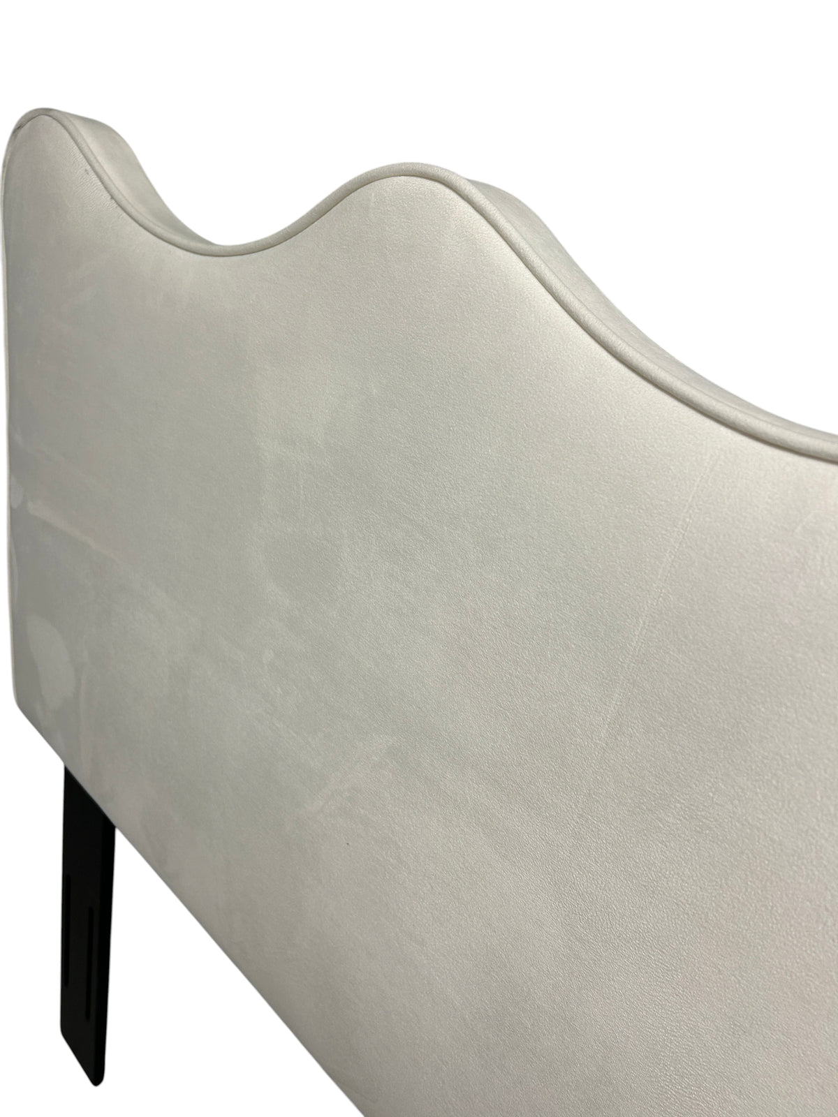 Off-white queen velvet headboard with black legs.