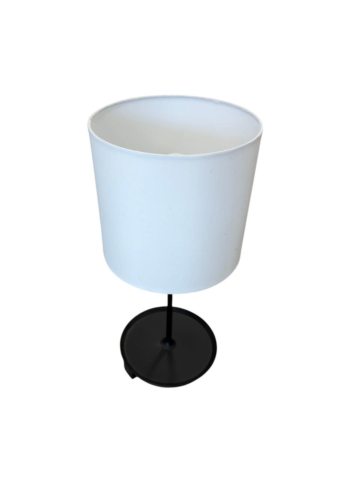Black table lamp with a charging port.