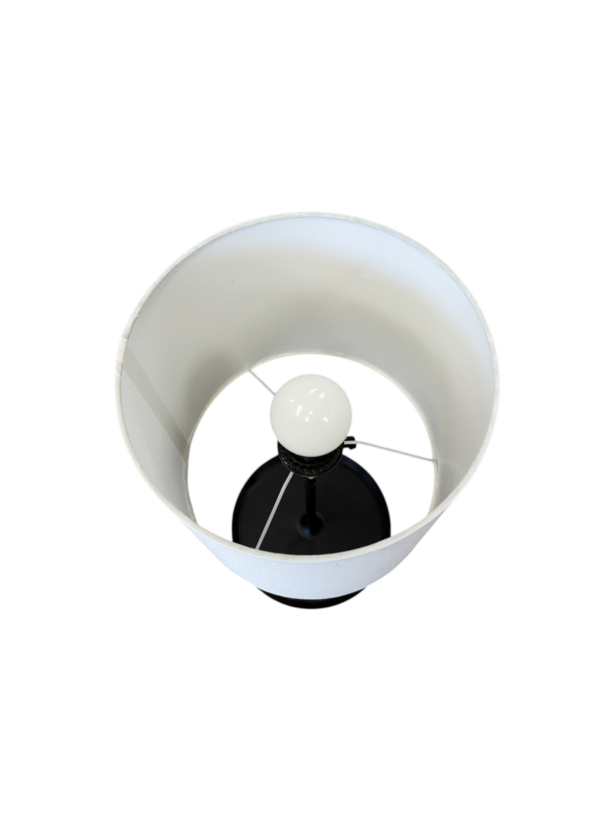 Black table lamp with a charging port.