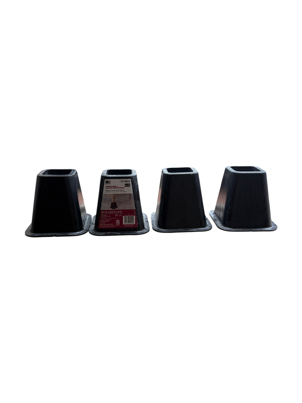 Set of 4 black plastic bed risers.