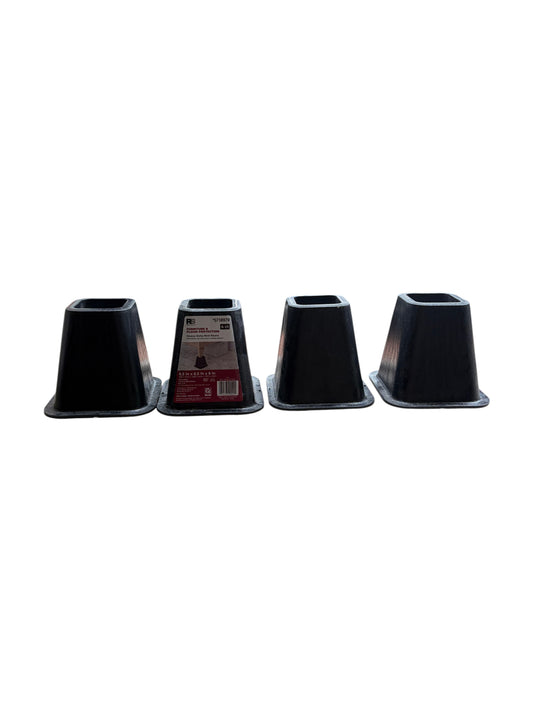 Set of 4 black plastic bed risers.