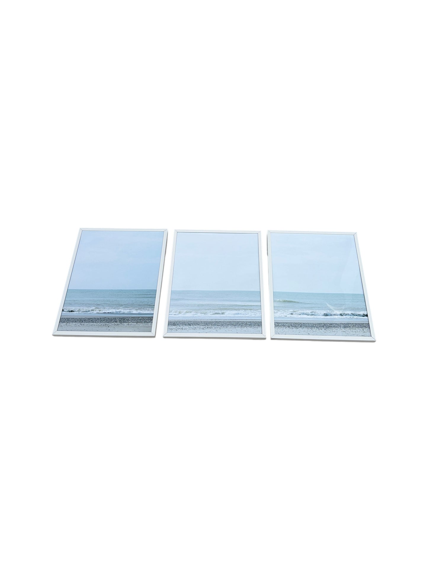 Set of 3 framed beach landscapes with white frames.