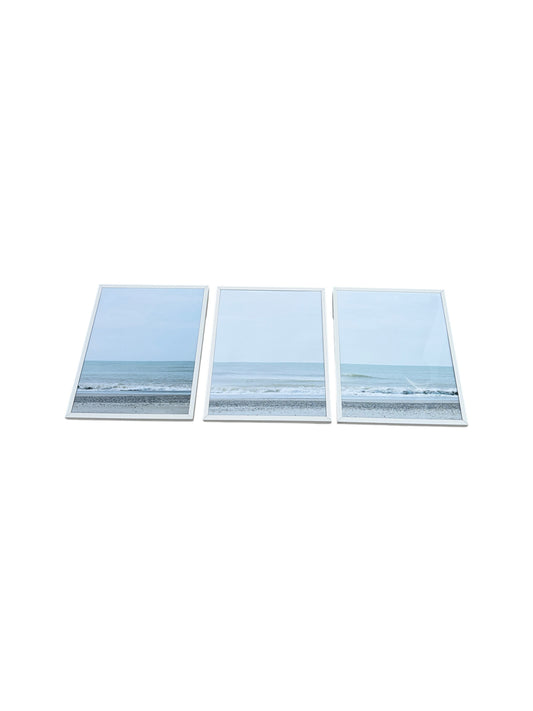 Set of 3 framed beach landscapes with white frames.