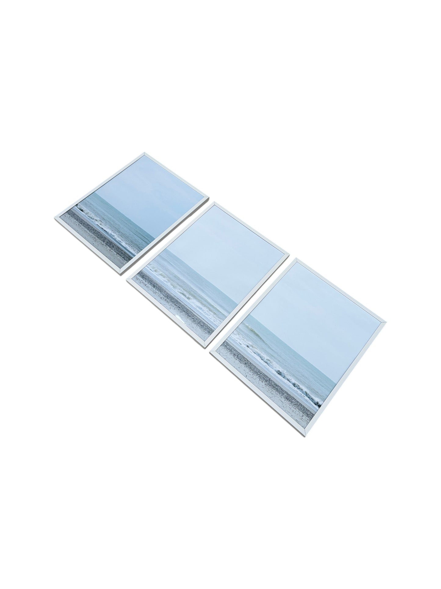 Set of 3 framed beach landscapes with white frames.