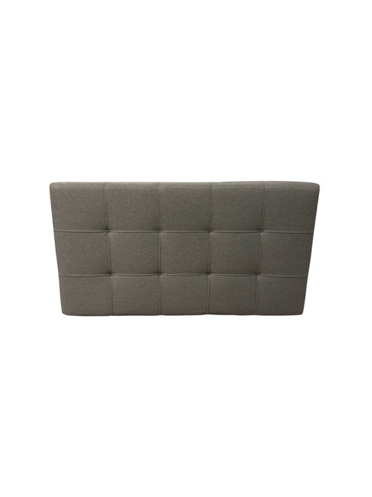 Gray upholstered twin headboard.