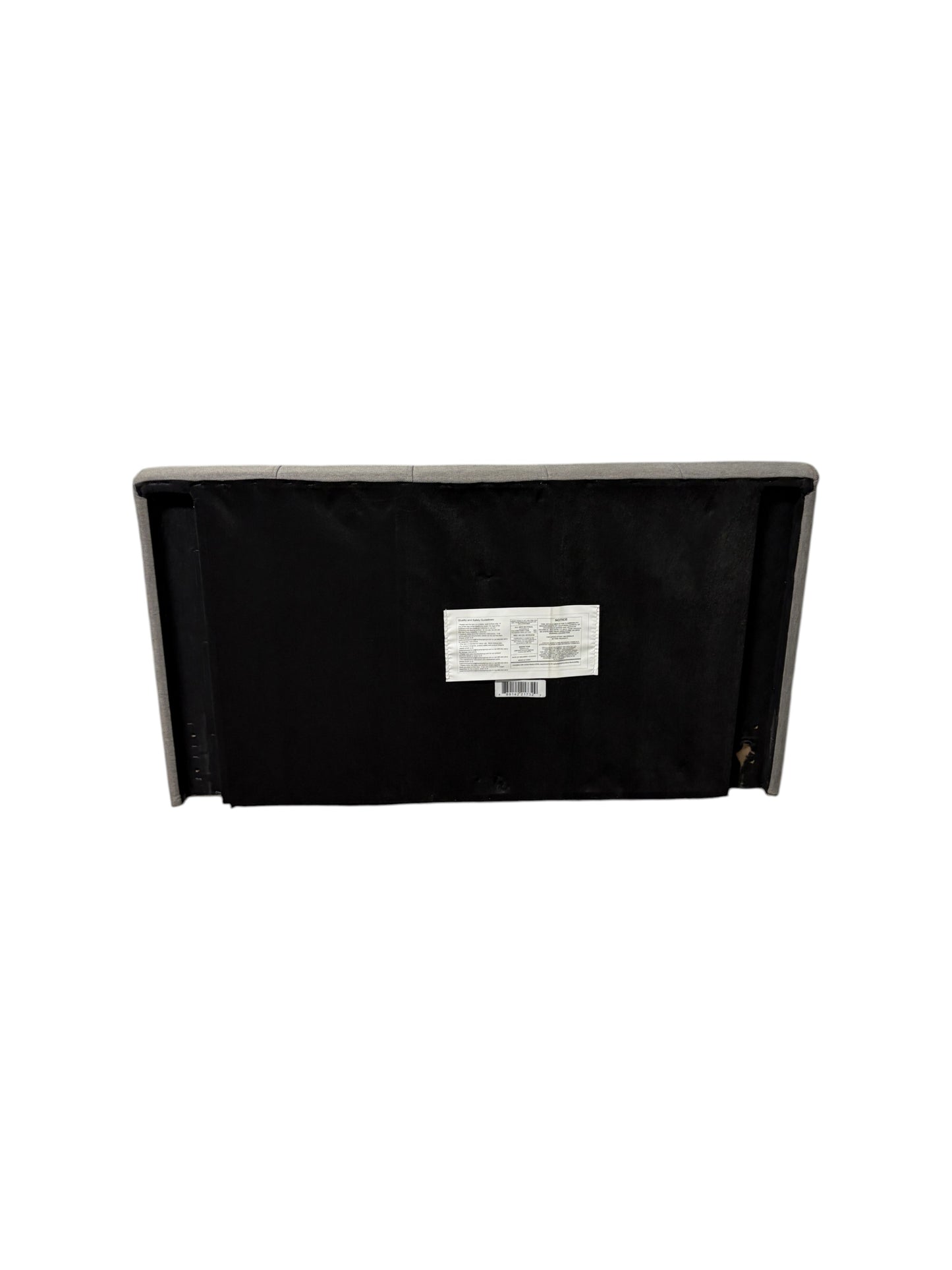 Gray upholstered twin headboard.