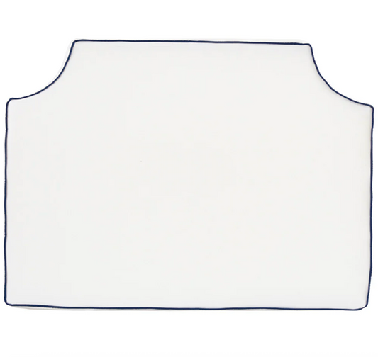 Room 422 twin white headboard with navy blue piping trim along the edges.