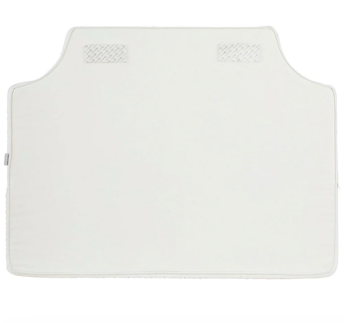 Room 422 twin white headboard with navy blue piping trim along the edges.